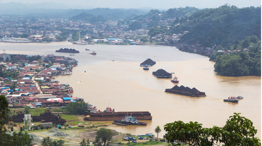 Large coal barges on the Mahakam River at Samarinda, Indonesia (Creative Commons)